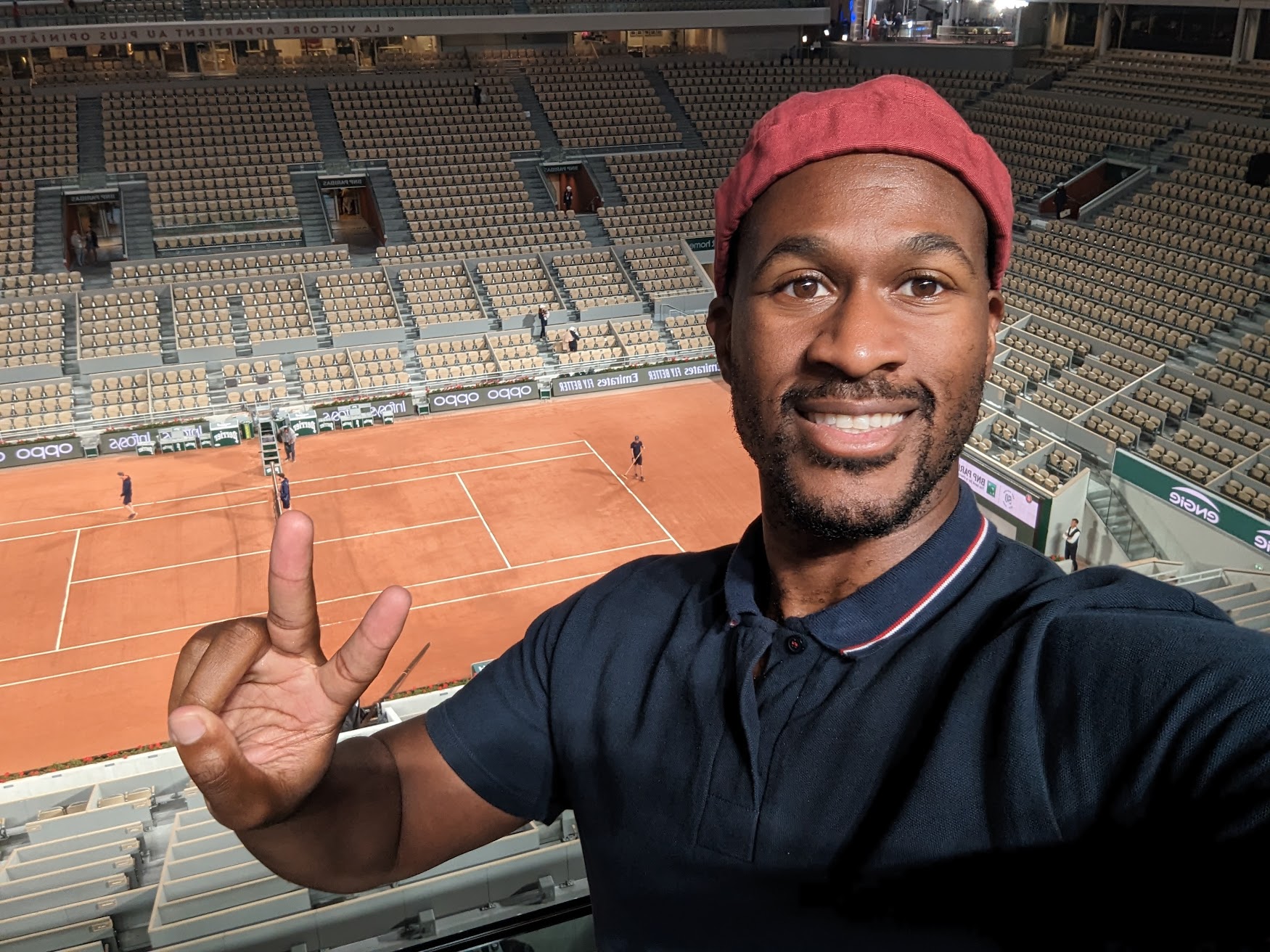 Me holding the peace sign at Roland Garros